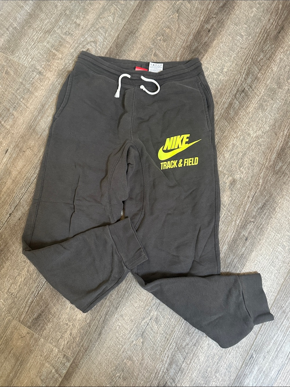 Nike Men’s Gray Joggers with Yellow Track & Field Logo Small